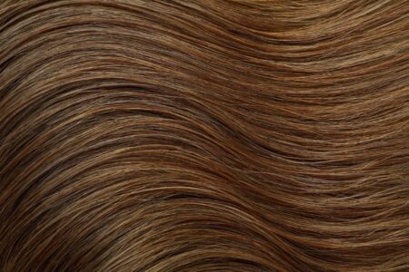 dark female hair on whole background close up scaled 1